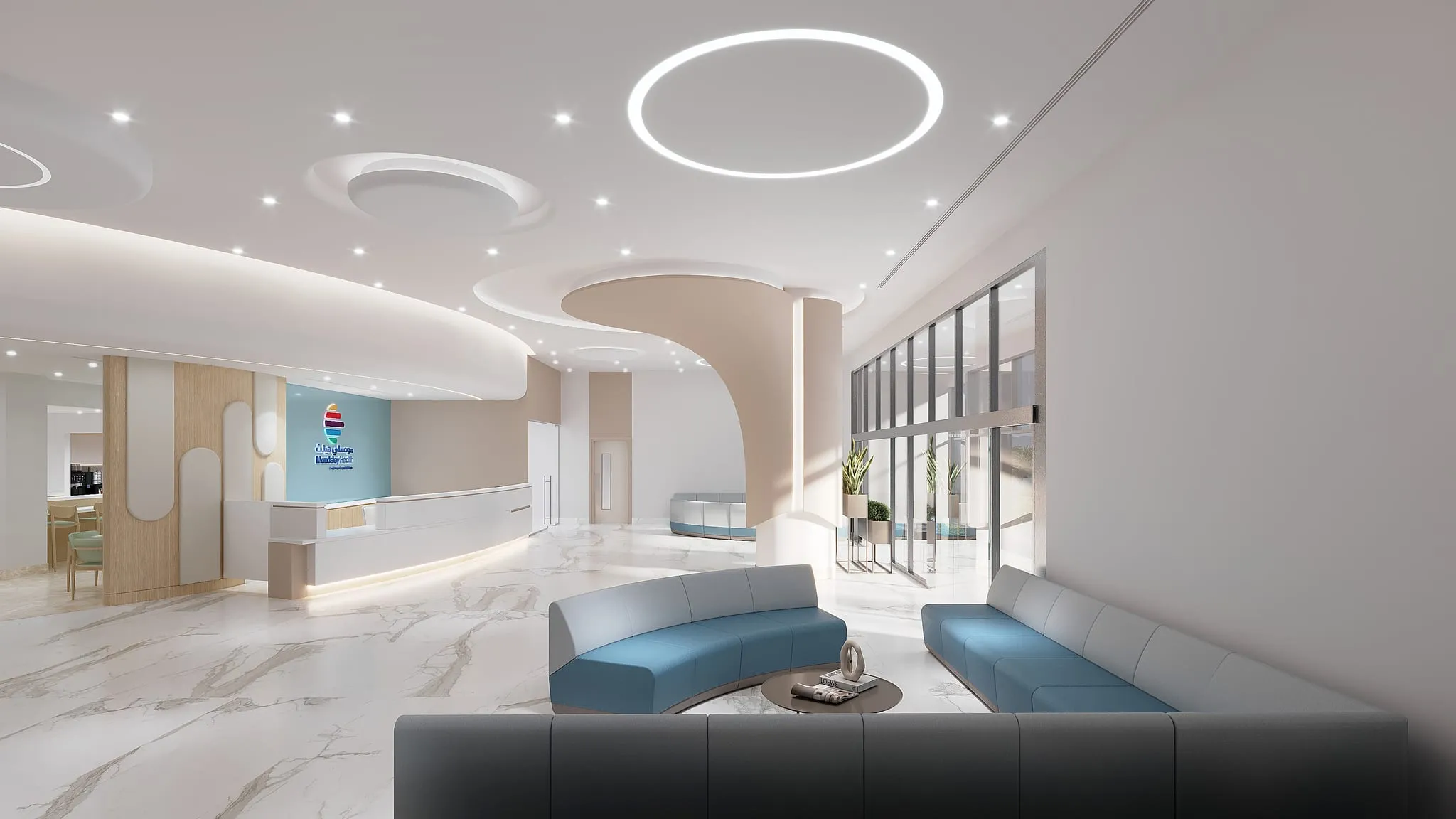 Architect’s visualisation of the hospital’s main entrance hall from the seating area: curved blue sofas around a low table, with the reception desk and glazed entrance beyond