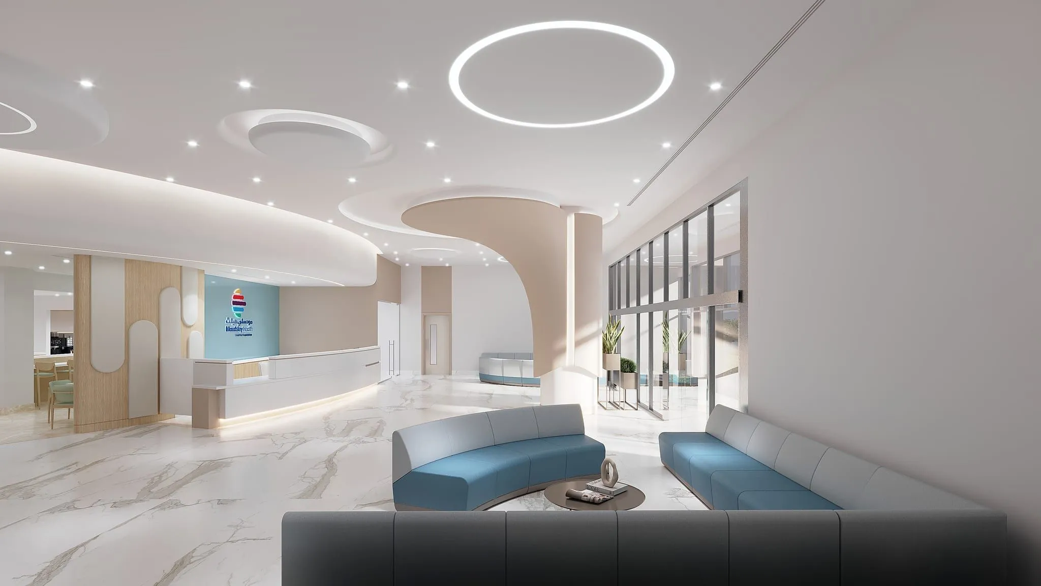 Architect’s visualisation of the hospital’s main entrance hall from the seating area: curved blue sofas around a low table, with the reception desk and glazed entrance beyond